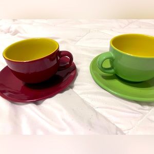 2 teacups and 2 saucers red and green with yellow interior
